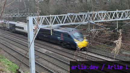AWC Class 390 passing Madeley Foot Bridge