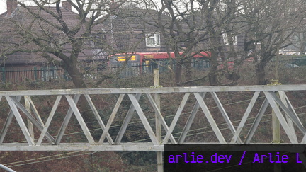 Enviro200 passing Madeley Foot Bridge